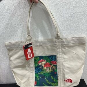 The North Face Beige Tote with Red Mushroom Design
